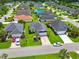 Street view of a residential neighborhood featuring manicured lawns, mature trees, and a fountain at 10106 Duval Dr., Murrells Inlet, SC 29576
