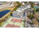 Aerial view of condos, tennis court, and parking, showing the property's layout at 1100 Possum Trot Rd. # B202, North Myrtle Beach, SC 29582