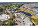 Aerial view featuring complex, parking, pond, golf course, and surrounding community at 1100 Possum Trot Rd. # B202, North Myrtle Beach, SC 29582