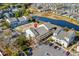 Aerial view of community featuring tennis courts, pond, parking, and complex at 1100 Possum Trot Rd. # B202, North Myrtle Beach, SC 29582