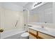 Bathroom features a tub and shower combination, vanity with sink and a large mirror at 1100 Possum Trot Rd. # B202, North Myrtle Beach, SC 29582