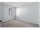 Cozy bedroom featuring neutral carpeting, a window with blinds, and pale blue walls at 1100 Possum Trot Rd. # B202, North Myrtle Beach, SC 29582