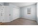 Comfortable bedroom with a double closet, neutral carpeting, and a window at 1100 Possum Trot Rd. # B202, North Myrtle Beach, SC 29582