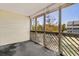 Screened porch featuring a view of trees, a hanging basket and concrete flooring at 1100 Possum Trot Rd. # B202, North Myrtle Beach, SC 29582