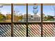 View from screened porch overlooking tennis courts in a beautiful landscape setting at 1100 Possum Trot Rd. # B202, North Myrtle Beach, SC 29582
