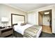 Comfortable bedroom view showcasing one bed, a nightstand, closet, and exterior access door at 1105 S Ocean Blvd. # 1144, Myrtle Beach, SC 29577