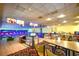 Bowling alley with tables, chairs, and neon lights at 1105 S Ocean Blvd. # 1144, Myrtle Beach, SC 29577