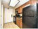 Compact kitchenette featuring modern appliances, wood cabinets, and tile flooring at 1105 S Ocean Blvd. # 1144, Myrtle Beach, SC 29577