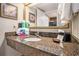 Bathroom featuring granite countertops, sink, and vanity mirror at 1105 S Ocean Blvd. # 420, Myrtle Beach, SC 29577