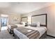 Comfortable bedroom featuring two beds and a serene view from the balcony at 1105 S Ocean Blvd. # 420, Myrtle Beach, SC 29577