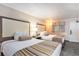 Bedroom with two beds, bedside table, and window with patterned curtains at 1105 S Ocean Blvd. # 420, Myrtle Beach, SC 29577