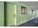 Hallway leading to rooms with exterior windows and neutral-toned flooring at 1105 S Ocean Blvd. # 420, Myrtle Beach, SC 29577