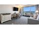 Balcony view from a living room with a sleek television, dining area, and serene ambiance at 1105 S Ocean Blvd. # 420, Myrtle Beach, SC 29577