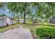 Spacious backyard featuring mature trees, a playset, trampoline, and a storage shed at 1108 Chicora Blvd., Conway, SC 29526
