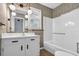 Bathroom featuring floral wallpaper, framed mirror, vanity and bathtub at 1108 Chicora Blvd., Conway, SC 29526