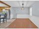 Eat-in kitchen featuring stainless steel appliances and ample cabinets, adjacent to an area with wood flooring at 1108 Chicora Blvd., Conway, SC 29526