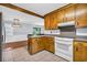 Traditional kitchen featuring classic wood cabinets and a breakfast bar looking into a dining area at 1108 Chicora Blvd., Conway, SC 29526