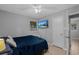 This bedroom offers ample space, a mounted TV, and great natural light at 1111 King St., Myrtle Beach, SC 29577