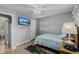 Comfortable bedroom with mounted TV, natural light and light walls at 1111 King St., Myrtle Beach, SC 29577