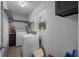 Laundry room with washer, dryer, storage shelves, and window for natural light at 1111 King St., Myrtle Beach, SC 29577