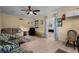 Spacious living room features a ceiling fan, tile flooring, and comfortable seating at 1111 King St., Myrtle Beach, SC 29577