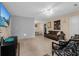 Inviting living room with tile floors, comfortable seating, ceiling fan, and a view into the dining area at 1111 King St., Myrtle Beach, SC 29577