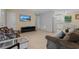 Spacious living room with tile floors, comfortable seating, and a view into the kitchen and dining area at 1111 King St., Myrtle Beach, SC 29577
