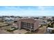 Aerial view of complex near ocean, with blue sky, nearby beach houses and street at 120 Dogwood Dr. N # 209, Murrells Inlet, SC 29576