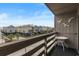 Balcony view featuring charming beach houses and palm trees, creating a relaxing coastal atmosphere at 120 Dogwood Dr. N # 209, Murrells Inlet, SC 29576