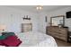 Cozy bedroom with neutral walls, coastal decor, and a comfortable bed with floral patterned quilt at 120 Dogwood Dr. N # 209, Murrells Inlet, SC 29576