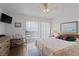 Comfortable bedroom with a queen-size bed, dresser, and access to a balcony with natural light at 120 Dogwood Dr. N # 209, Murrells Inlet, SC 29576