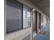 Exterior hallway with muted paint, window, dark door, and carpet at 120 Dogwood Dr. N # 209, Murrells Inlet, SC 29576