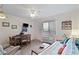 Comfortable living room with a daybed, dining area, and window offering views of the surroundings at 120 Dogwood Dr. N # 209, Murrells Inlet, SC 29576