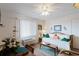 Bright living space features a comfy daybed, dining table, and large window for ample natural light at 120 Dogwood Dr. N # 209, Murrells Inlet, SC 29576