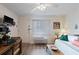 Inviting living space featuring a daybed, dining setup, and window providing ample natural light at 120 Dogwood Dr. N # 209, Murrells Inlet, SC 29576