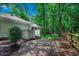 Spacious wooded backyard with a quaint privacy fence and mature trees at 1204 Pine Valley Rd., North Myrtle Beach, SC 29582
