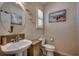 Charming powder room with a stylish sink, toilet, and coastal-inspired decor for a welcoming space at 1204 Pine Valley Rd., North Myrtle Beach, SC 29582
