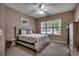 Cozy bedroom with natural light, ceiling fan, and beach-themed decor for a relaxing ambiance at 1204 Pine Valley Rd., North Myrtle Beach, SC 29582
