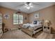 Comfortable bedroom with a ceiling fan, decorative artwork, and a soothing color scheme for a tranquil retreat at 1204 Pine Valley Rd., North Myrtle Beach, SC 29582