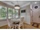 Cozy breakfast nook featuring large windows with plantation shutters and a charming chandelier at 1204 Pine Valley Rd., North Myrtle Beach, SC 29582