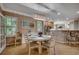 Dining area with light wood table, upholstered chairs, and French doors to exterior at 1204 Pine Valley Rd., North Myrtle Beach, SC 29582