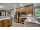 Updated kitchen featuring stainless steel appliances, custom wood cabinetry, and sleek marble countertops at 1204 Pine Valley Rd., North Myrtle Beach, SC 29582
