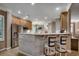 Open kitchen area with a counter and seating with stainless steel appliances and light wood cabinets at 1204 Pine Valley Rd., North Myrtle Beach, SC 29582