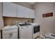 Laundry room with washer, dryer, sink, and storage space at 1204 Pine Valley Rd., North Myrtle Beach, SC 29582