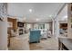 Expansive living room with a fireplace, tiled floors, and a neutral color palette, offering a cozy space at 1204 Pine Valley Rd., North Myrtle Beach, SC 29582