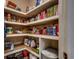 Walk-in pantry with shelving stocked with food, water, and a garbage can at 1204 Pine Valley Rd., North Myrtle Beach, SC 29582