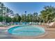 Relaxing round pool with lounge chairs, providing a serene outdoor experience at 1204 Pine Valley Rd., North Myrtle Beach, SC 29582