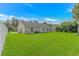 Beautifully landscaped backyard featuring healthy green grass at 125 Balsa Dr., Longs, SC 29568