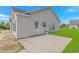 Home featuring a concrete patio and well-maintained yard at 125 Balsa Dr., Longs, SC 29568