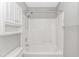 Bright bathroom featuring a combination tub and shower and vanity storage at 125 Balsa Dr., Longs, SC 29568